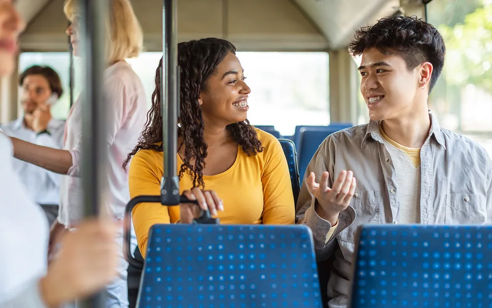 Passengers seated on a shared Barcelona airport bus