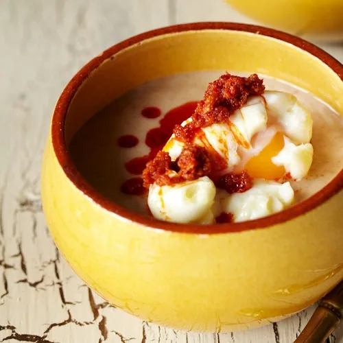 Tapas dish shown with a Barcelona cooking-class listing