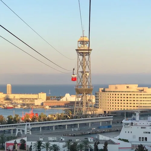 Port cable-car tower rising beside the Barcelona waterfront