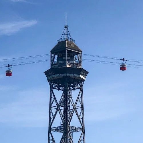 Steel port cable-car tower with cabins crossing the harbour