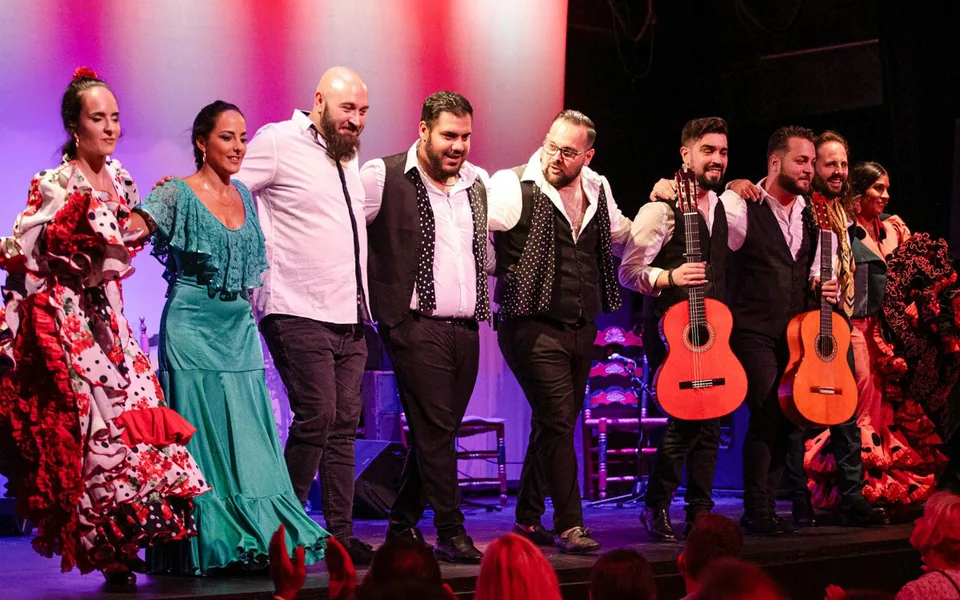Flamenco performers taking a bow on the City Hall stage