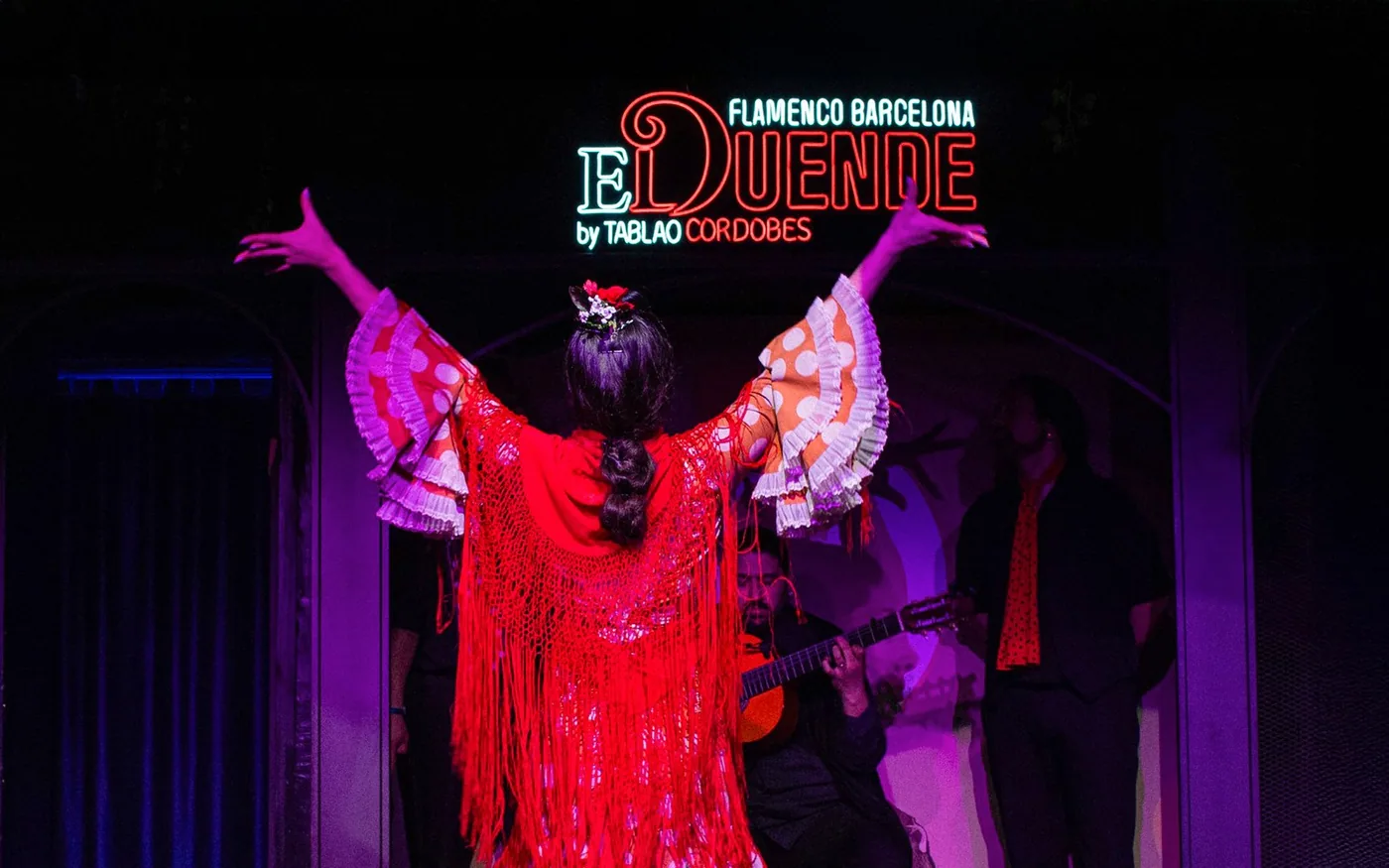 Promotional image of a red-shawl flamenco dancer for El Duende
