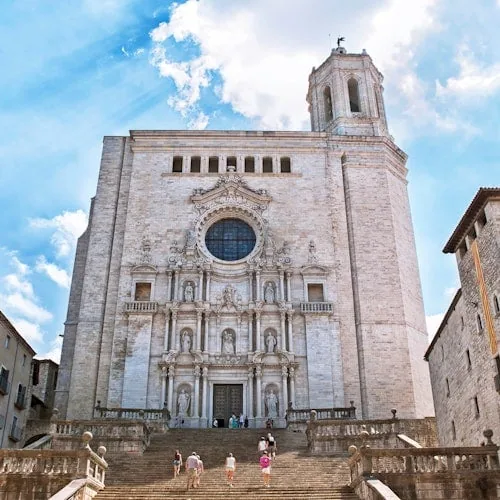 Steps leading to Girona Cathedral beneath a blue sky