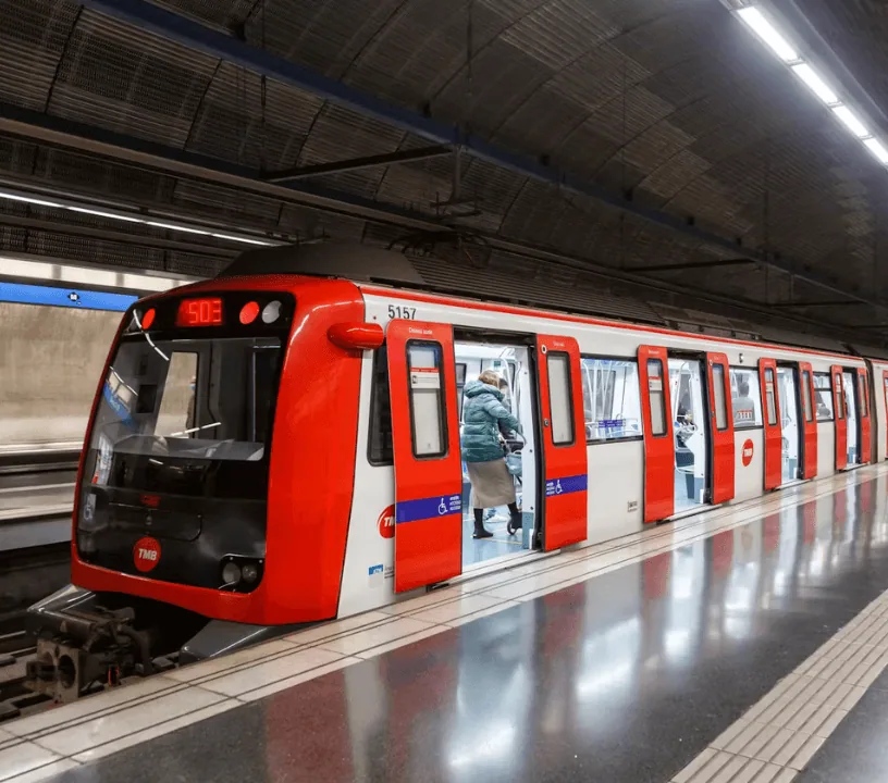 Red metro train at a Barcelona underground platform