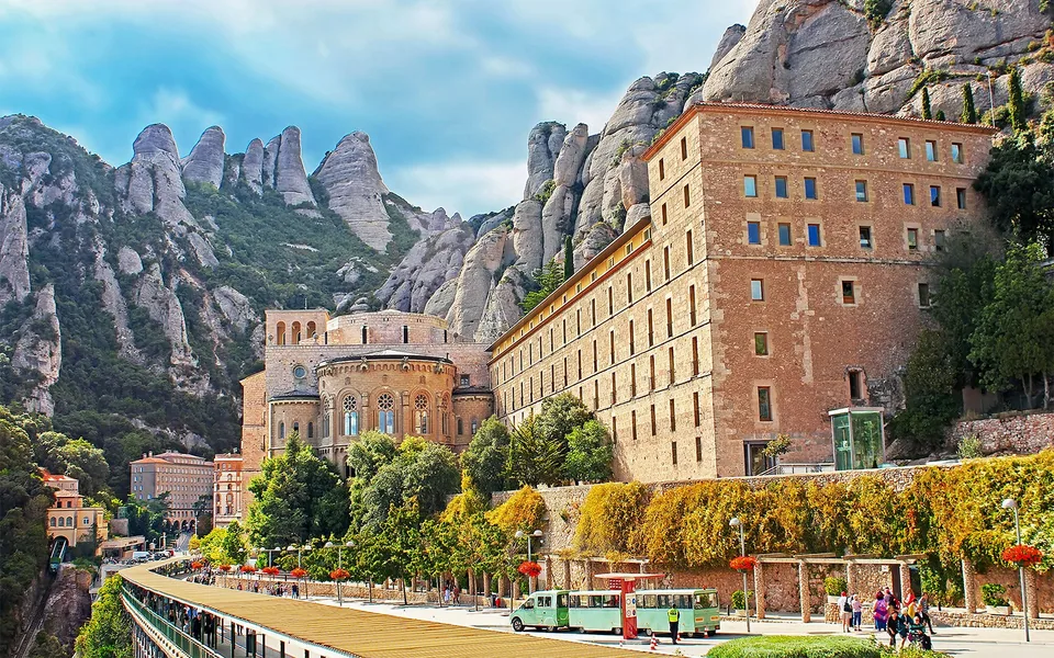 Montserrat monastery buildings beneath mountain peaks