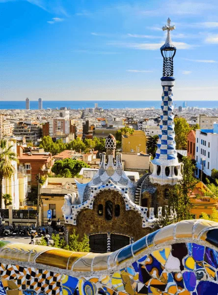 Mosaic terrace overlooking Park Güell pavilions and the Barcelona skyline