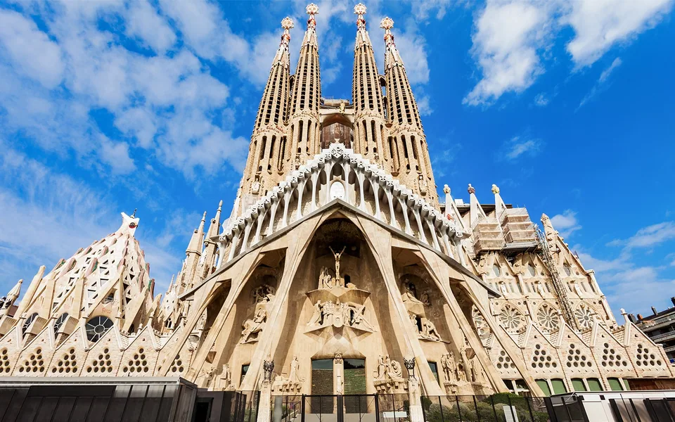 Sagrada Família towers rising above Barcelona beneath a blue sky